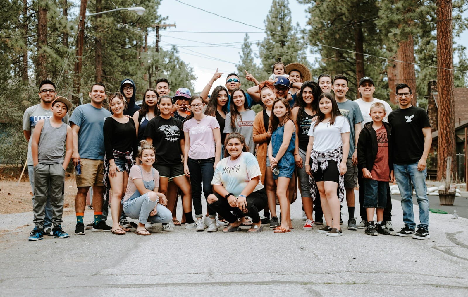 A big group of volunteers posing together on a street